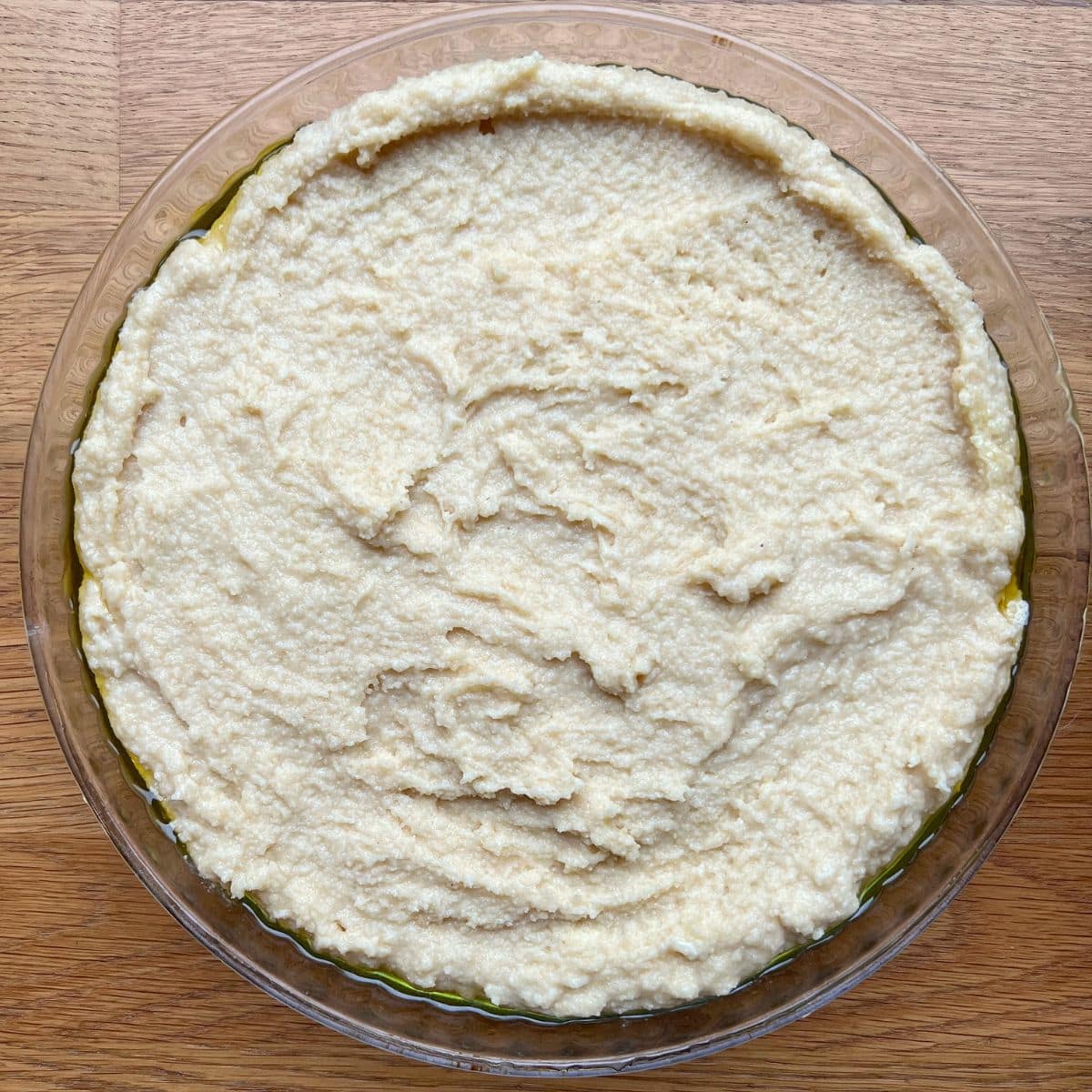 Basbousa batter in baking dish.