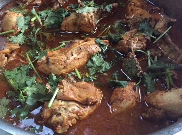 close up of chicken curry in saucepan