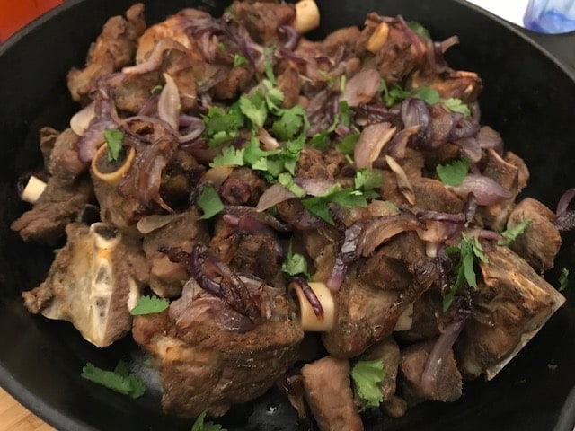 close up of lamb in cast iron skillet