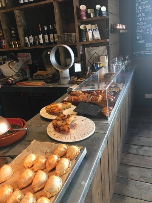 View of Tamp's food counter with empanadas and pastries.