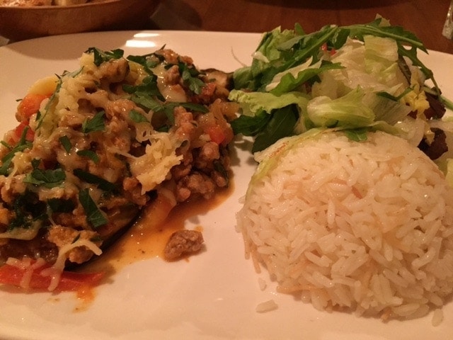 lamb aubergine with rice and a small salad