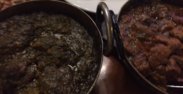 spinach curry next to a lamb curry