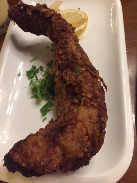 plate with fried battered masala fish