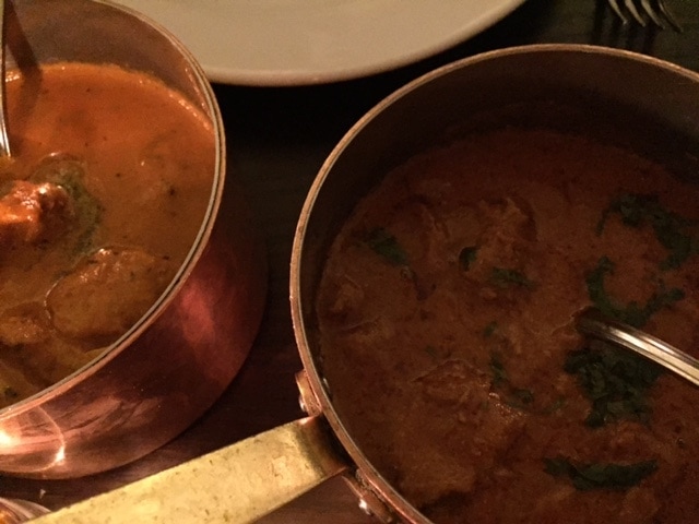 two curries in copper pots