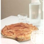 chicken pie on table with water jug