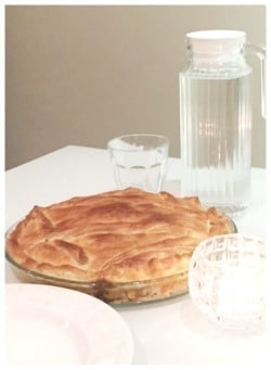 chicken pie on table with water jug