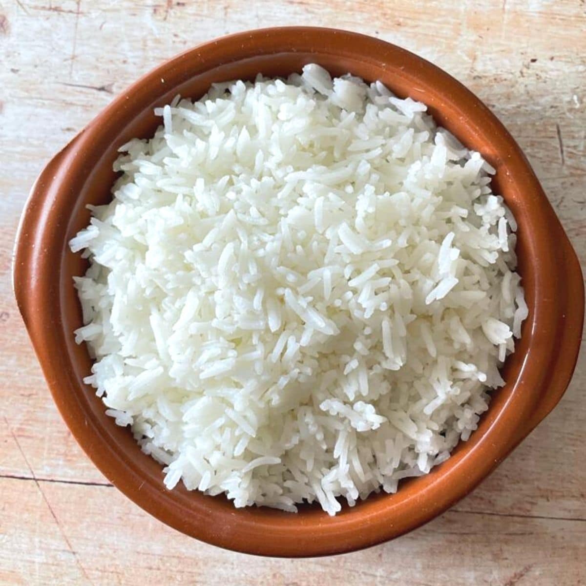 boiled rice in brown bowl