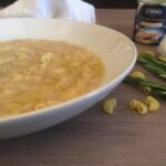 soup on table near pasta shells