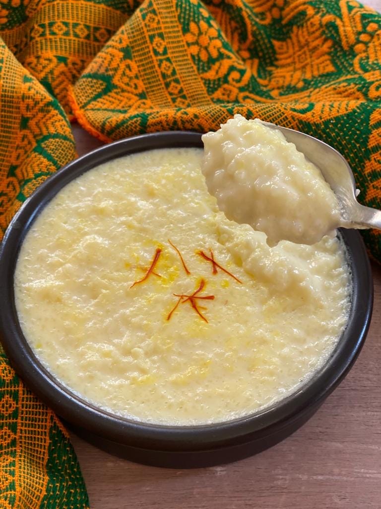 Spoon full of kheer showing the texture.