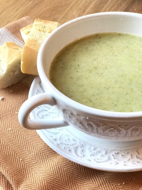 Broccoli soup in white bowl