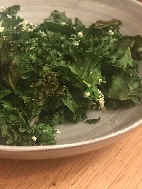 close up of baked kale with parmesan