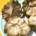 Image of four halves of custard apples showing interior and texture.