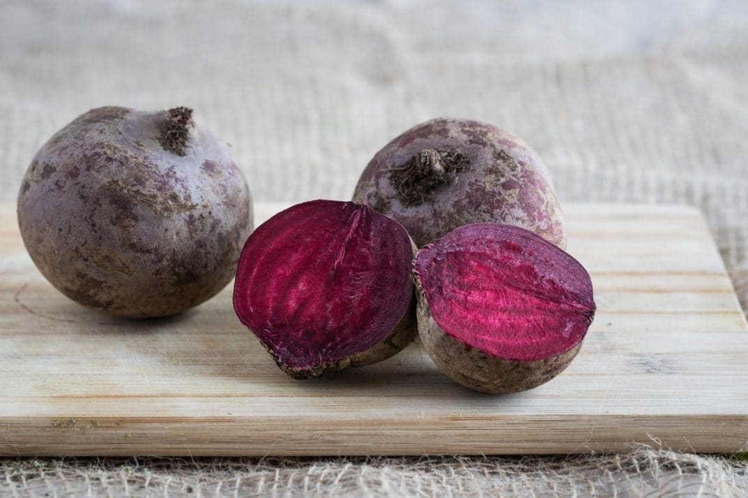 beets, halved and whole, on a chopping board