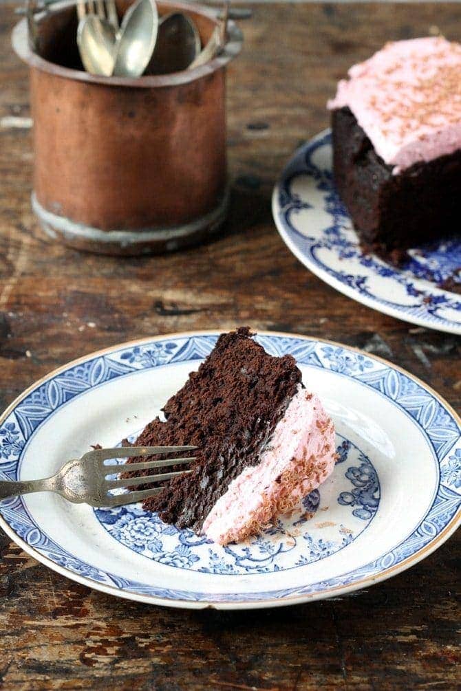 slice of cake with icing on small plate