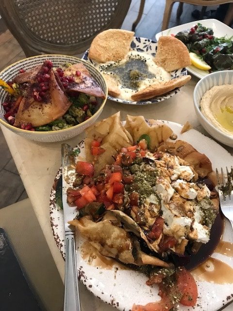 Two salads and labneh on table