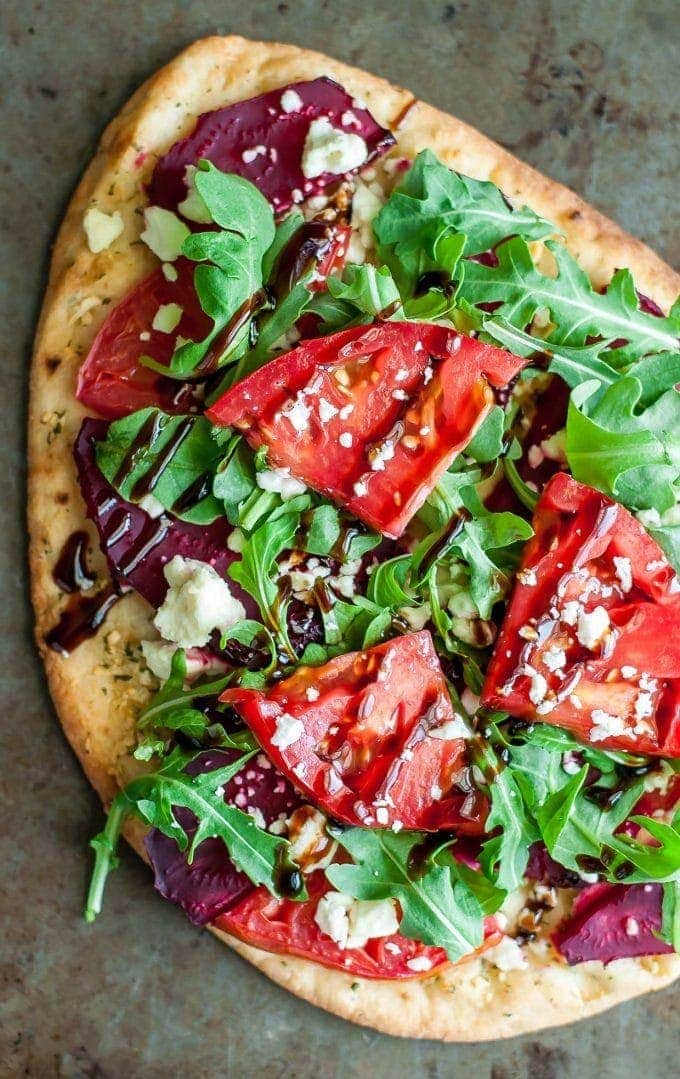 close up of flatbread with toppings