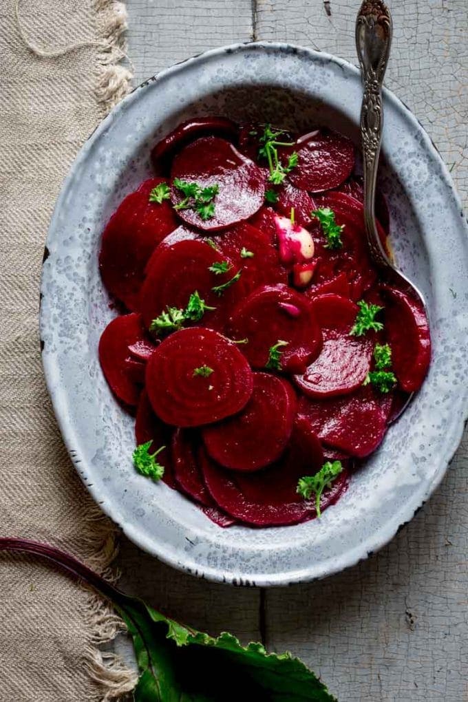 pickled beets in an oval dish