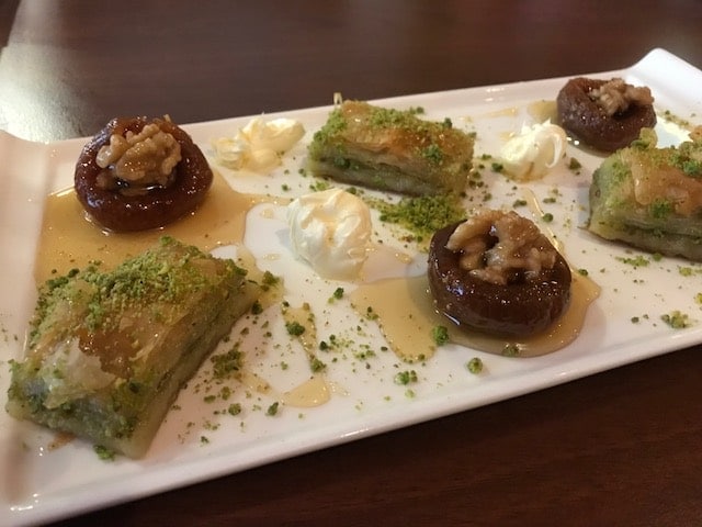 baklava and figs on platter with Turkish clotted cream
