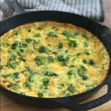 Broccoli potato frittata in iron skillet.