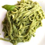 pasta covered in pesto