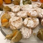 Ricciarelli on a plate with gooseberries