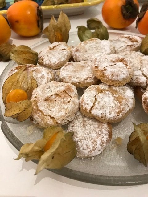 Ricciarelli on a plate with gooseberries