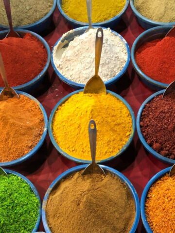 Bowls of colourful Indian spices at a market