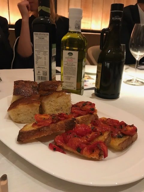 squares of focaccia and bruschetta with tomatoes