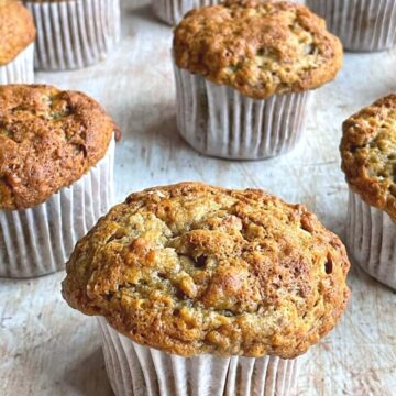 Banana muffins on wooden counter.