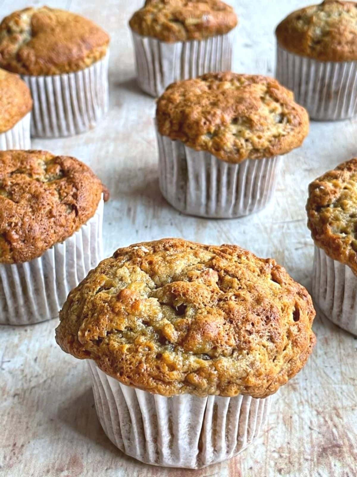 Freshly baked banana muffins on table.