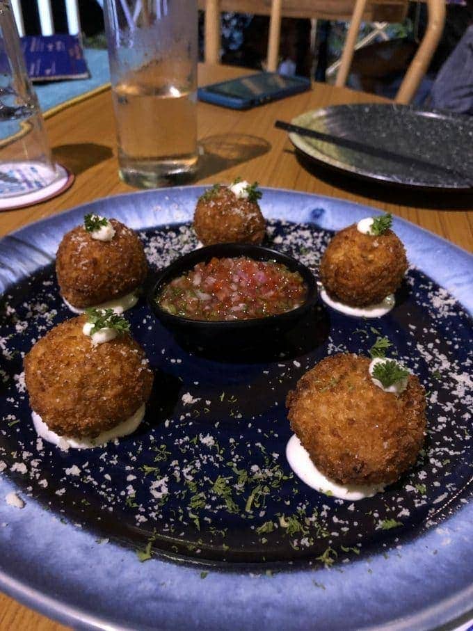 blue plate with 5 risotto balls