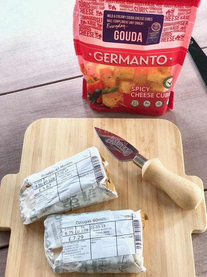three cheeses on small cheese board