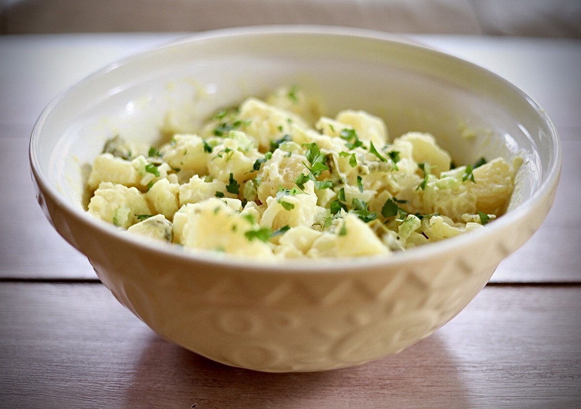 Potato salad in yellow bowl