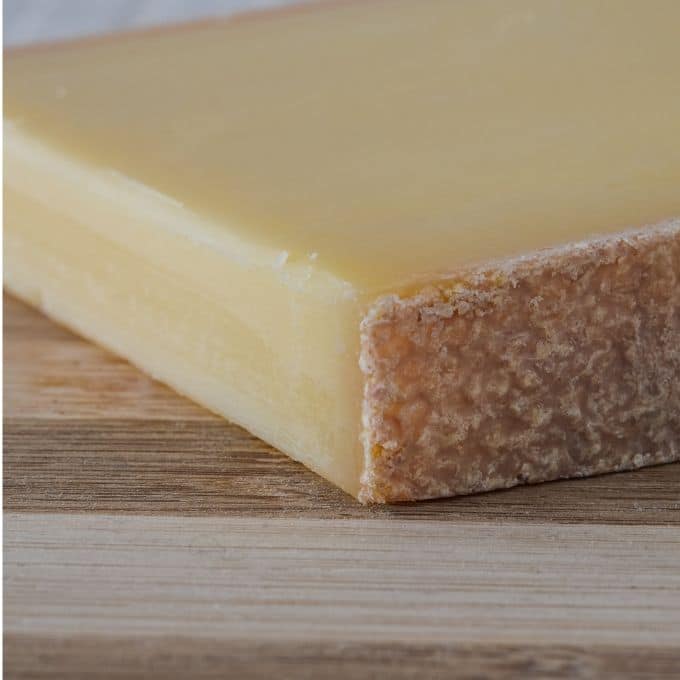 close up of a piece of Comté cheese