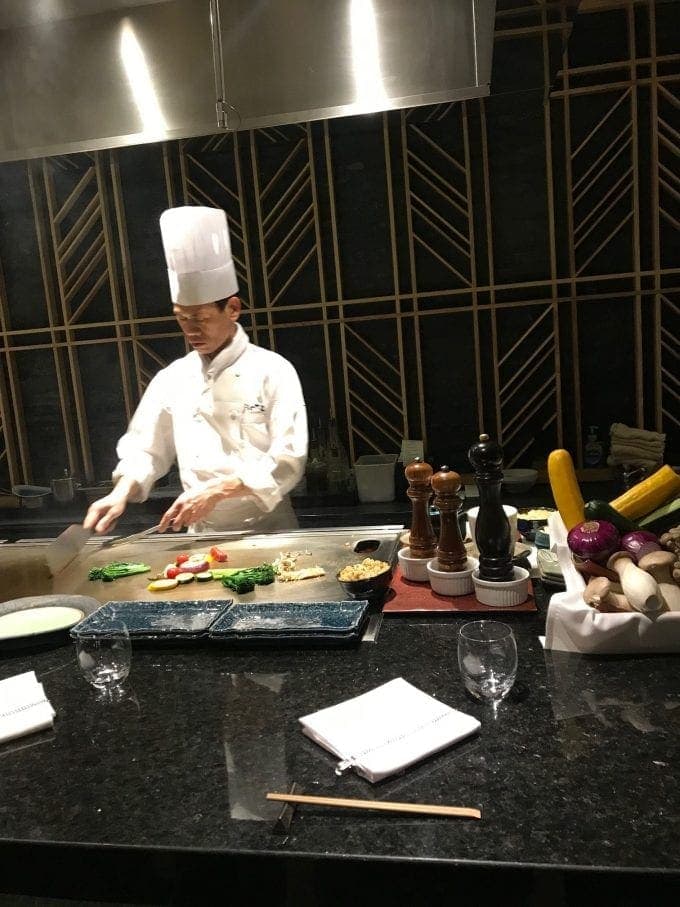 Chef preparing Japanese dishes.