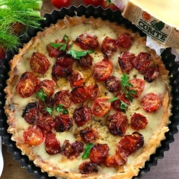 tomato tart next to a piece Comté cheese