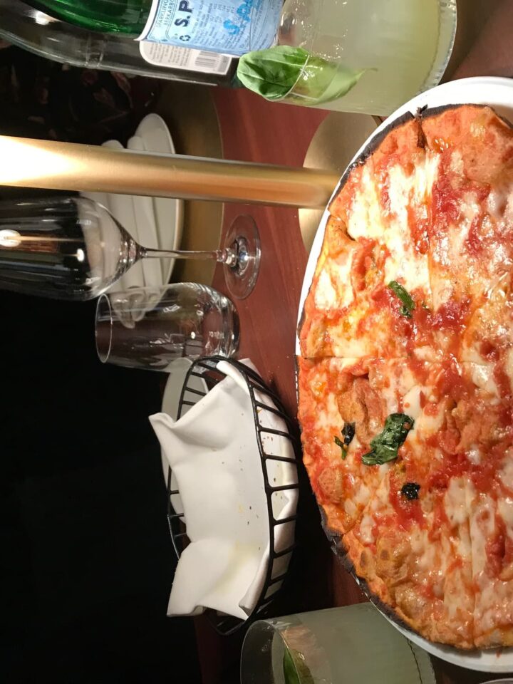 Thin pizza on a white plate