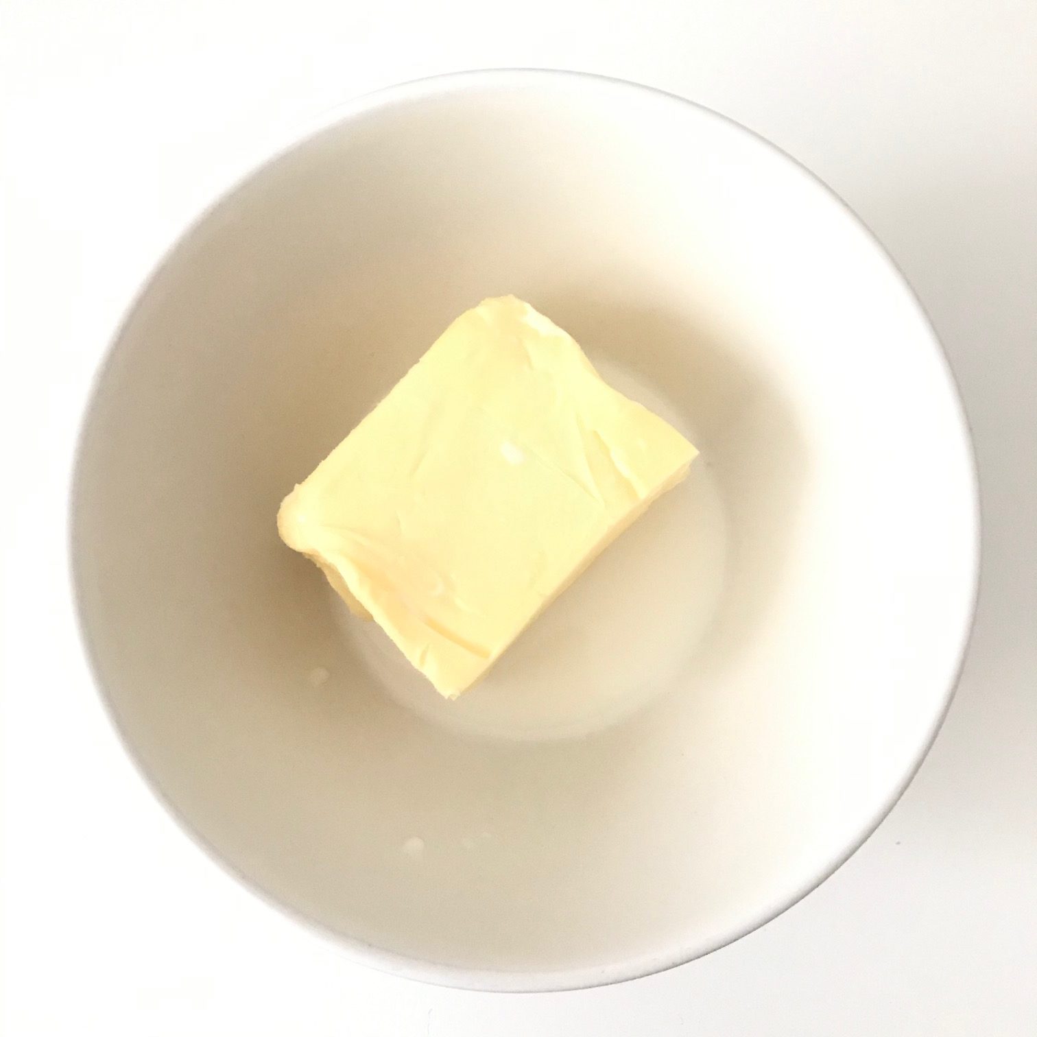 butter and milk in white bowl