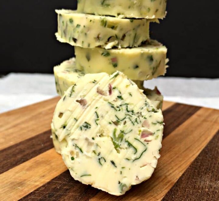 Sliced rounds Shallot butter on wooden board