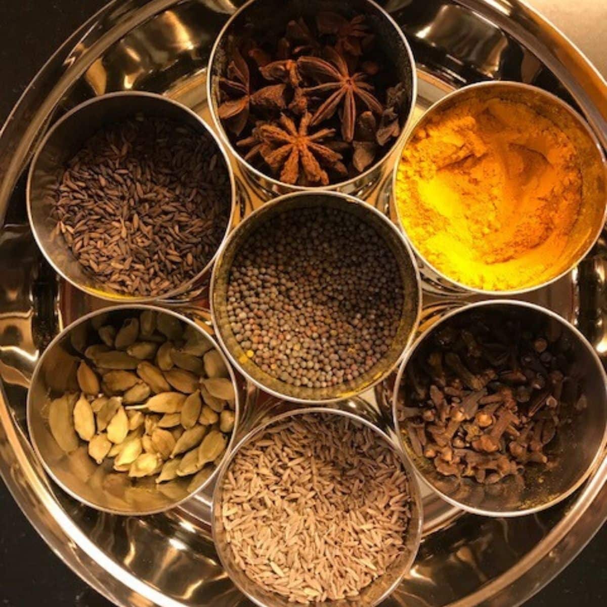 spice box with 7 bowls with different spices