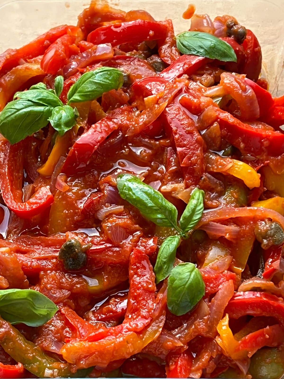 Closeup of peper with fresh basil in glass dish.onata 