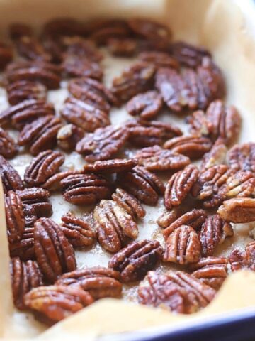 roasted pecans in a roasting dish