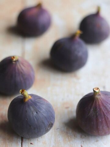 Black Mission figs on wooden table