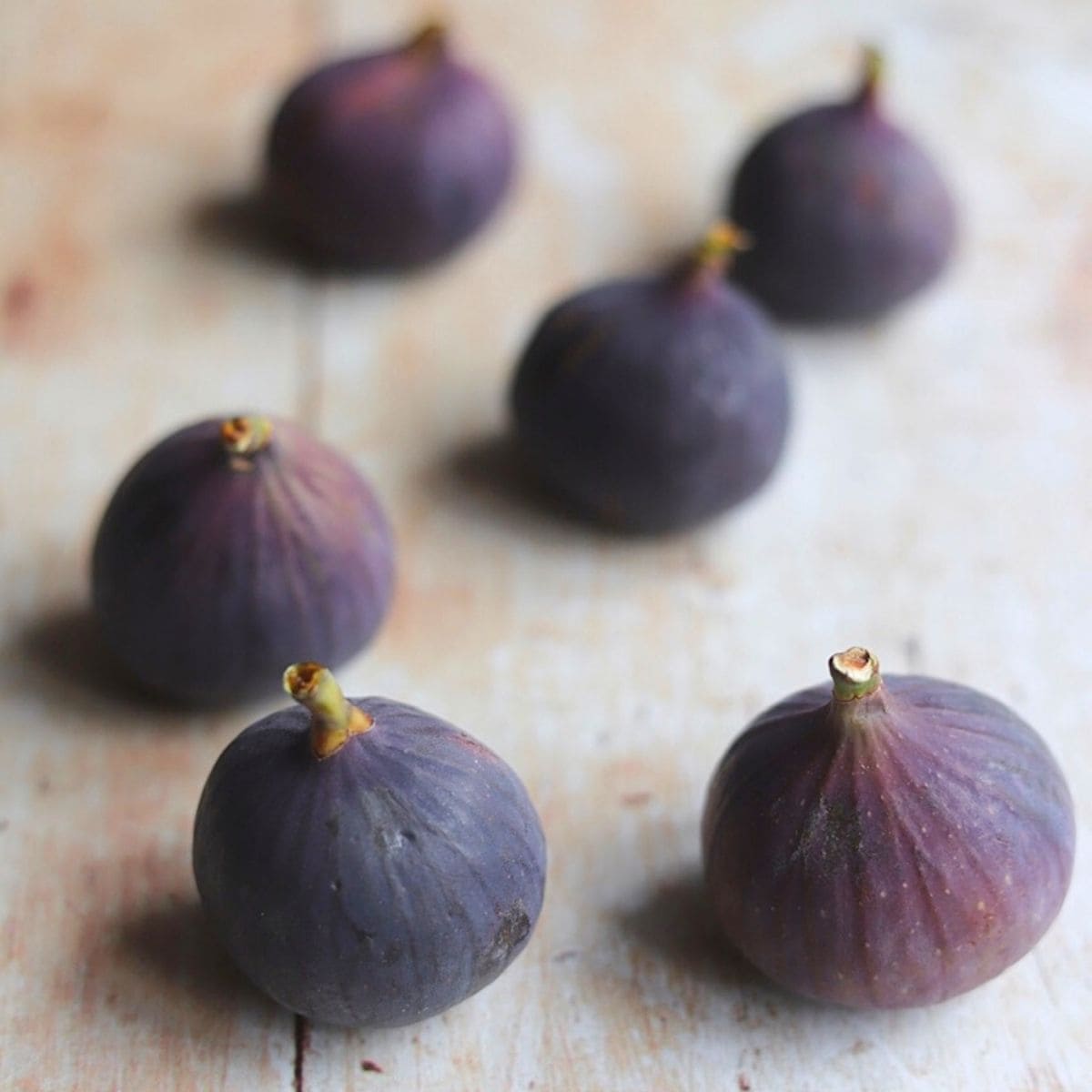 Black Mission figs on wooden table