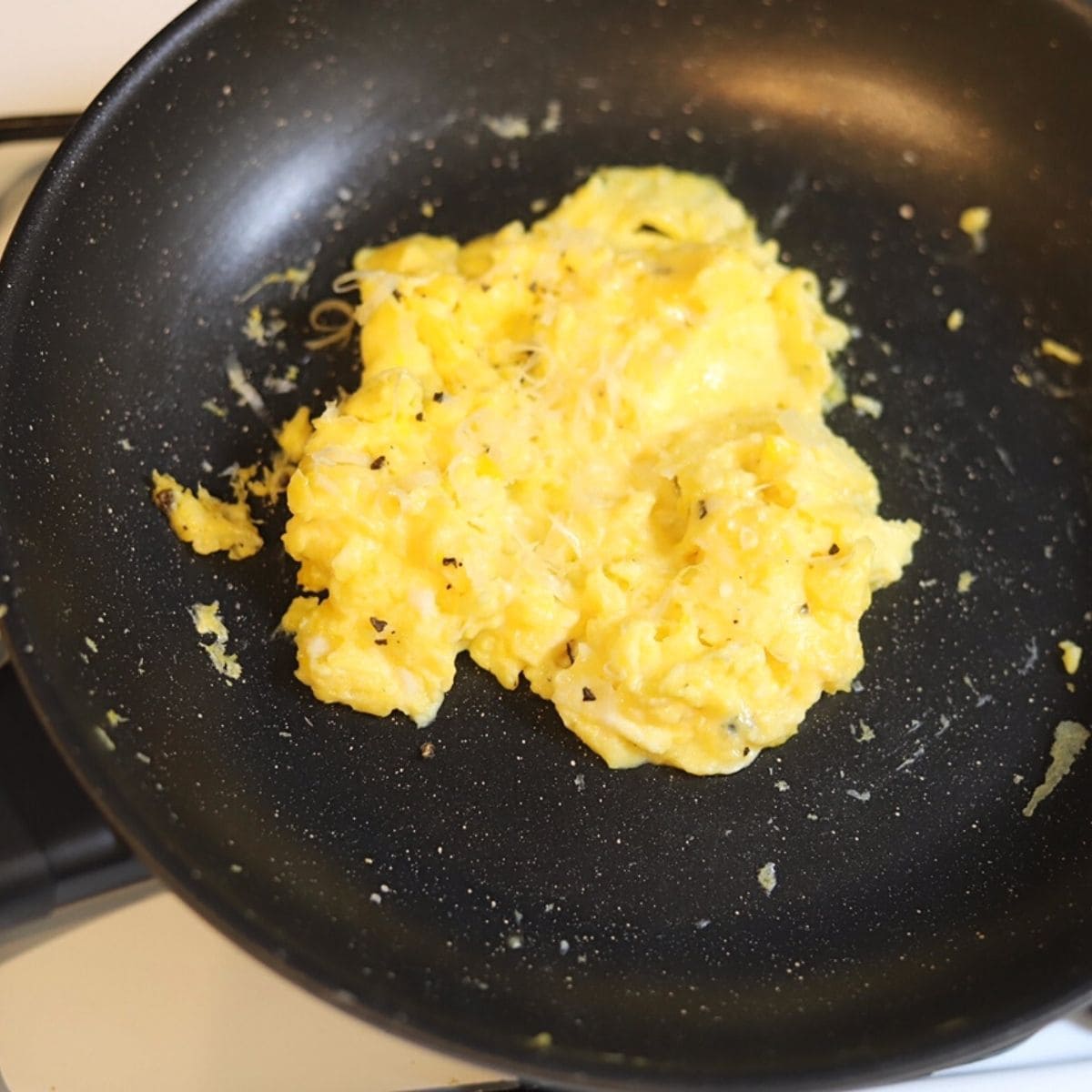 Scrambled eggs in a non stick skillet.
