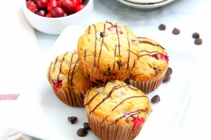 4 muffins with drizzle of chocolate sauce