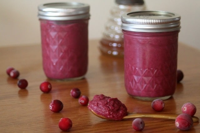 two mason jars of pink cranberry mustard