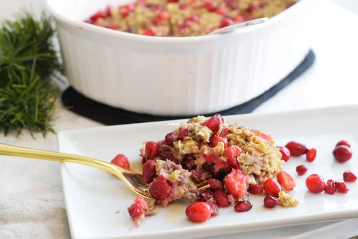 serving of baked oatmeal with cranberries on white plate