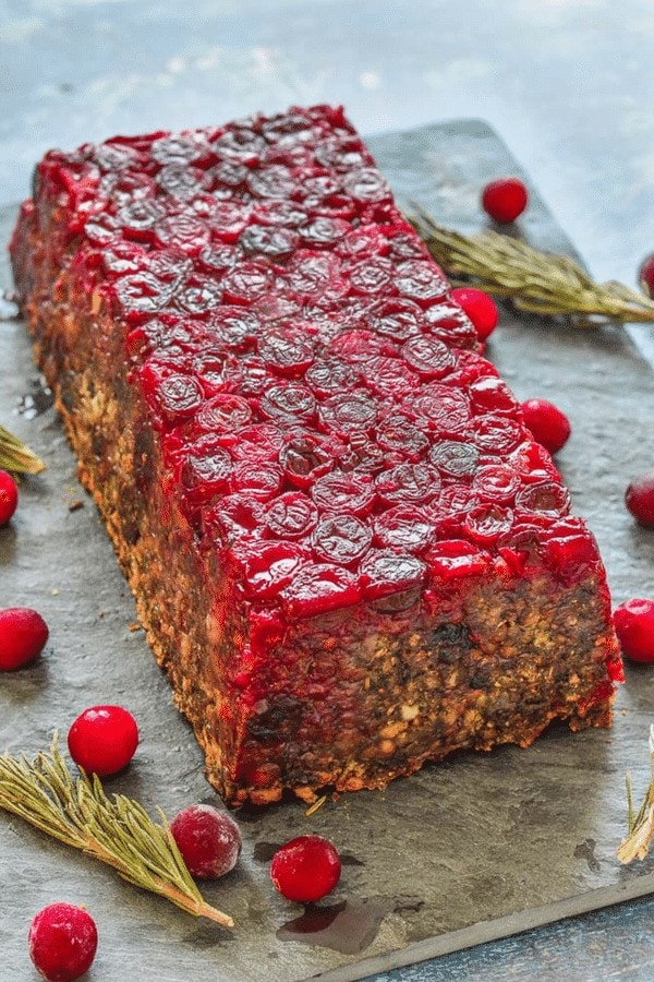 recatngular lentil loaf covered in layer of cooked cranberries