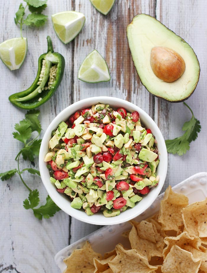 Image of cranberry avocado salsa in white bowl.